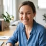 Small business owner smiling, using Memox chatbot on their website
